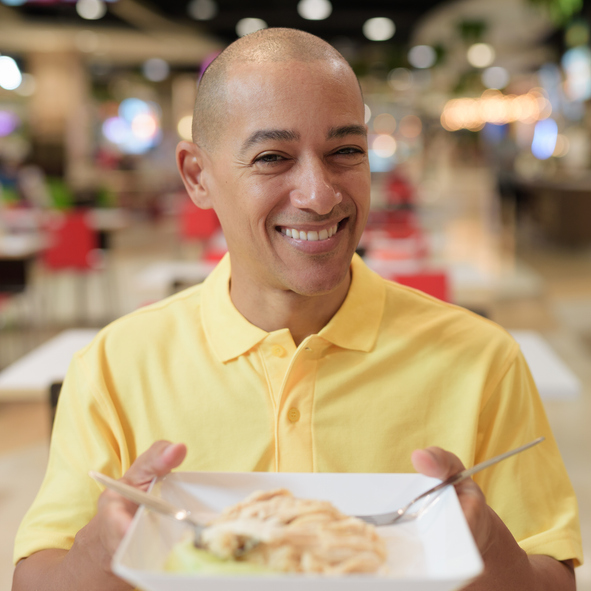 A woman's feet in a pair of colorful sneakers.